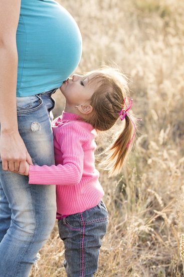 Pregnant Woman With Child